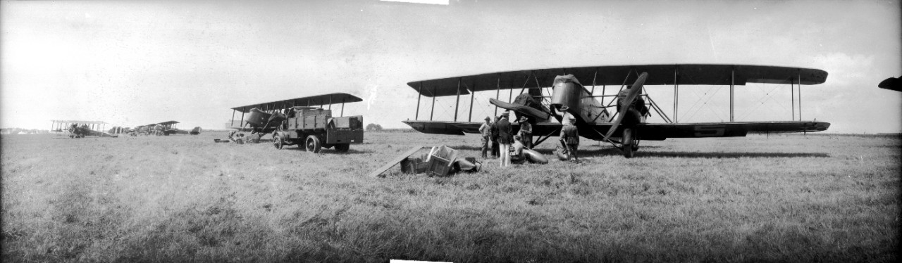 US Army officers inspect ordnance before it is mounted on a Martin MB-2 at Langley Field, Virginia. Occasion may be the 1921 Army-Navy bombing exercises off the Virginia capes.
