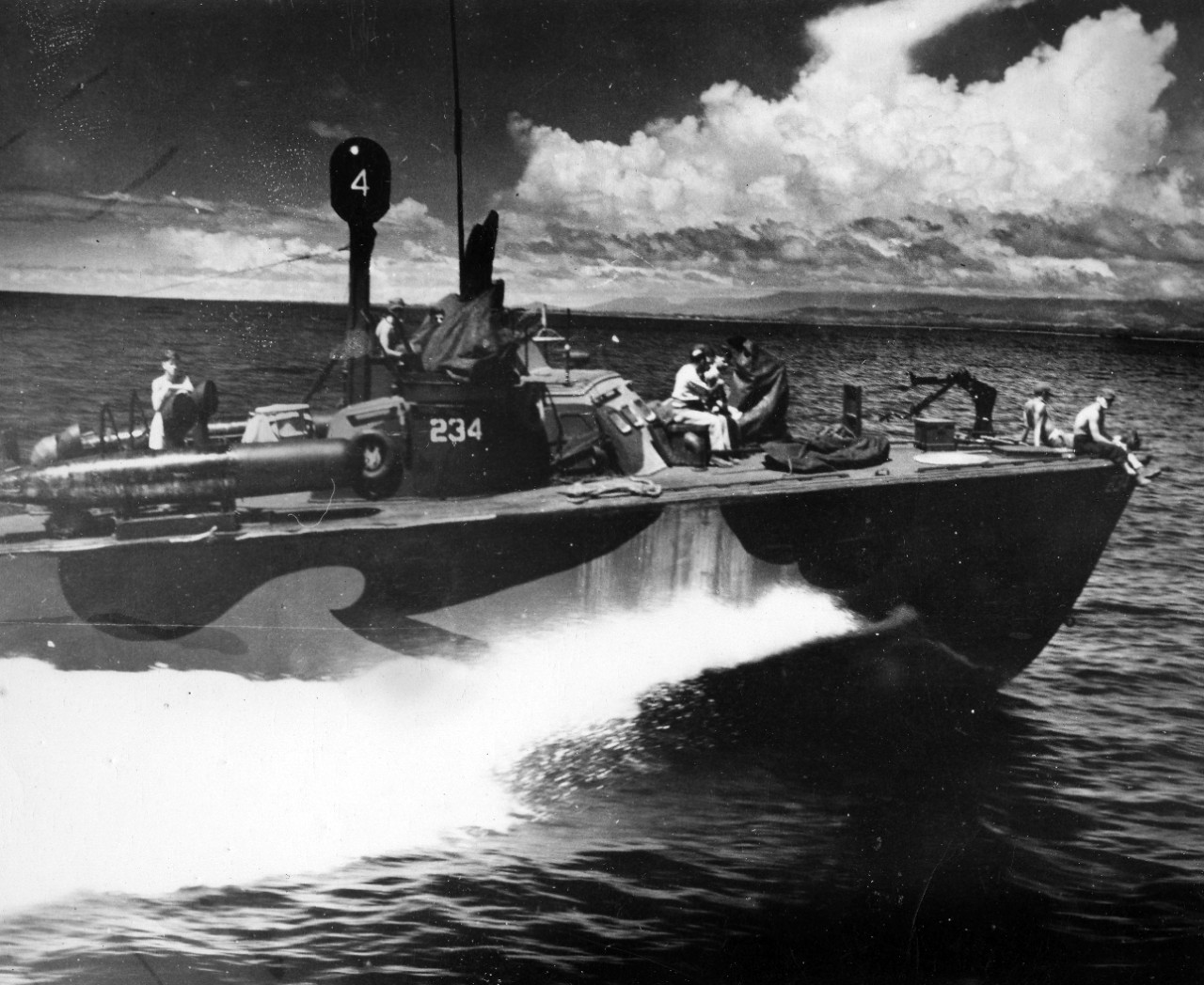 Collection of 50 photos related to the naval career of LT Stafford Wallace, Jr., during WWII in the Pacific Theater. The collection is mostly made up of PT boats (Wallace was a PT boat skipper). The following ships are included in the images: PT-234, PT-589, PT-245, PT-238, PT-228, PT- 594, PT-595, PT-596, PT-589, PT-590, PT-591, as well as several unidentified ships. Most of the photographs show the ships in “action” conducting maneuvers, though no locations are noted. Also included in the collection are views of Leyte (village and buildings) and Salamogue Harbor in Luzon, Philippines (showing a view of a sunken Japanese destroyer). There is a single image of USS Charles R. Ware (DD-865) and the motor launch of USS Franklin D. Roosevelt (CV-42). 