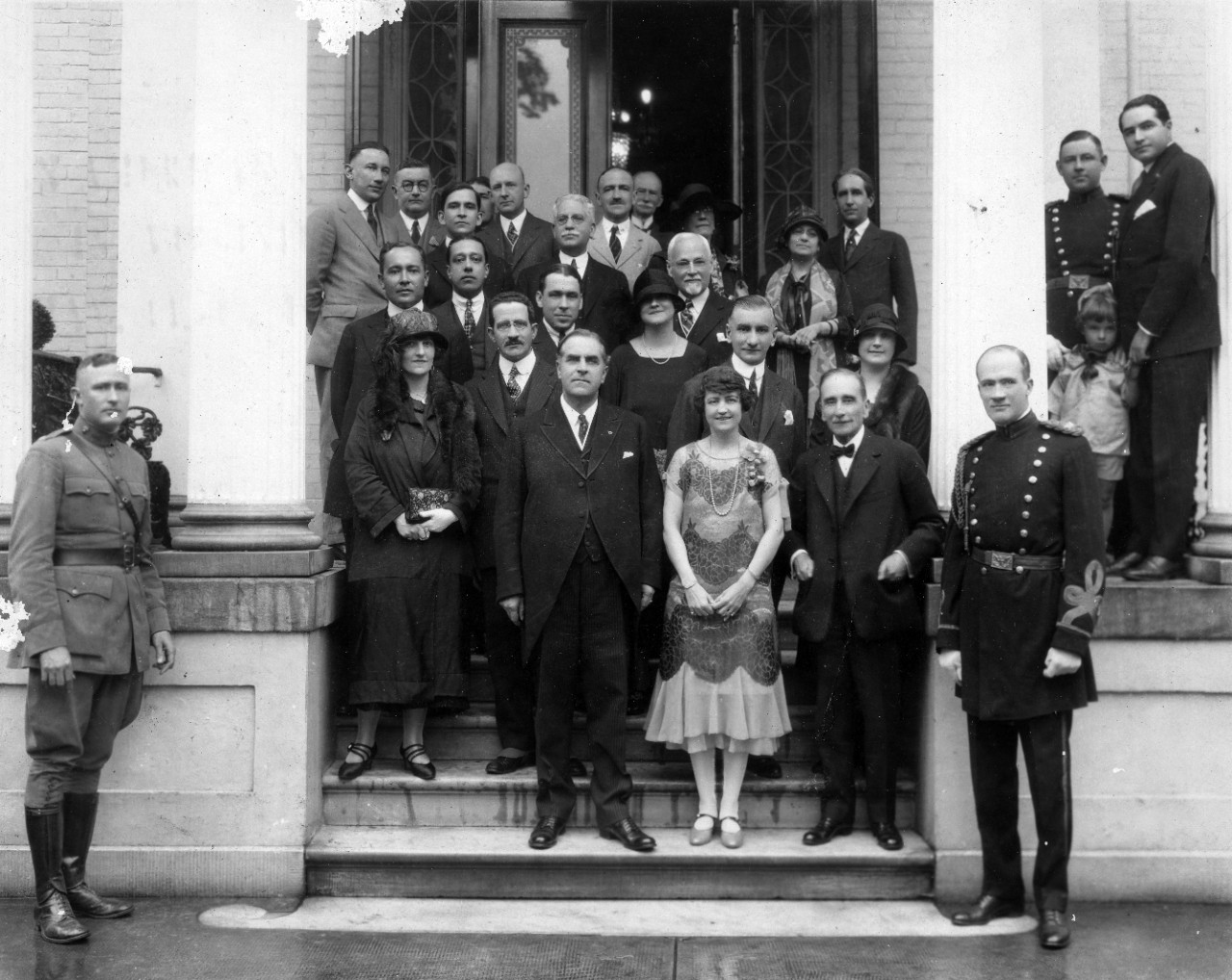 Album of 26 photographs commemorating the 11-14 May 1925 Pan American visit in Virginia. Book presented by the Virginia State Chamber of Commerce. This particular copy is inscribed to Rear Admiral Roger Welles who was Commandant of the 5th Naval District and also of the Naval Operating Base at Hampton Roads. Shown are foreign dignitaries and US Navy personnel (including RADM Welles) at US naval bases and airfields (possibly Hampton Roads) touring drydock, battleships, and observing aircraft in formation flight. Vinyl album binder suffered from serious mold issues, and was not retained.