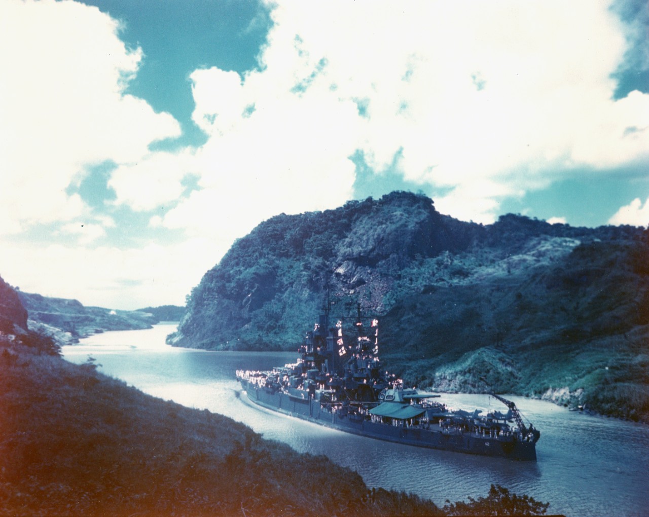 USS Idaho (BB-42) steaming through the Panama Canal, en route to the U.S. east coast for Navy Day celebrations in October 1945. Note: color in original transparency is extremely blue-shifted.
