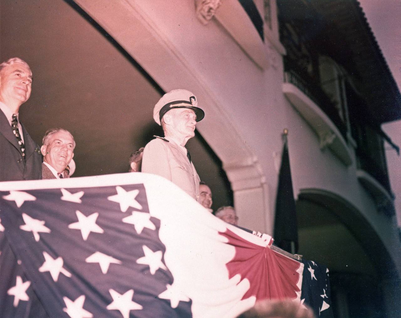 Vice Admiral Marc A. Mitscher, USN attends a ceremony, possibly on Navy Day at Jacksonville, Florida. Photo received from N.A.S. Jacksonville 13 November 1945. Note: color of original transparency is poor.