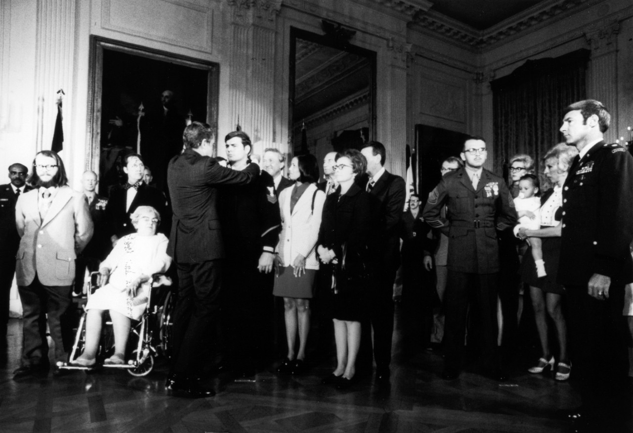 Navy Engineman First Class Michael E. Thornton receives the Medal of Honor from President Richard Nixon at the White House, for heroic action in Vietnam.