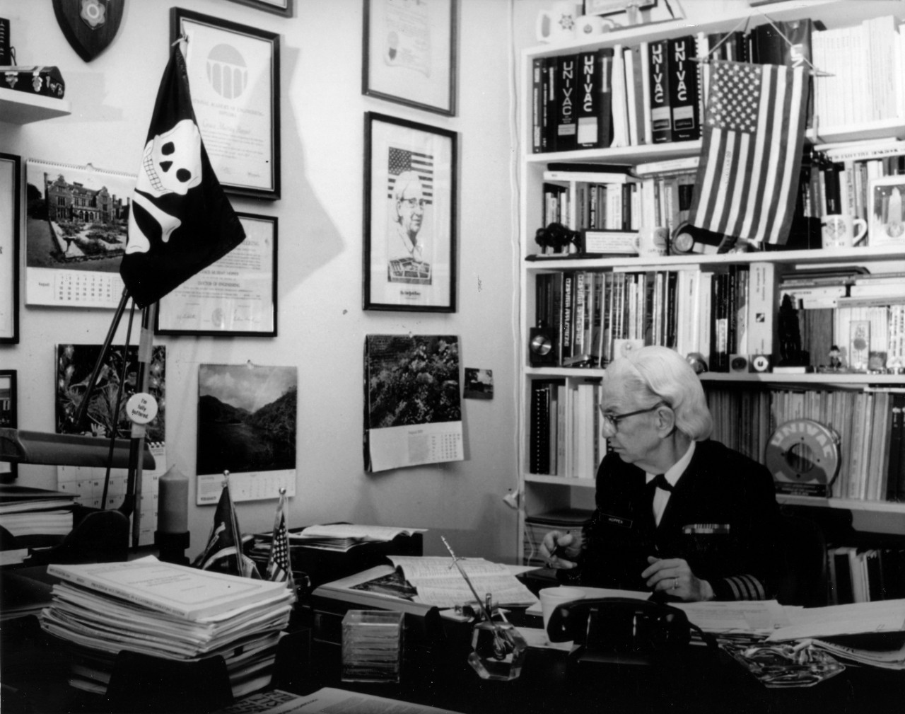 Captain Grace Hopper, head of the Navy Programming Section of the Office of the Office of the Chief of Naval Operations (OP 911F), at work in her Washington, D.C. office.