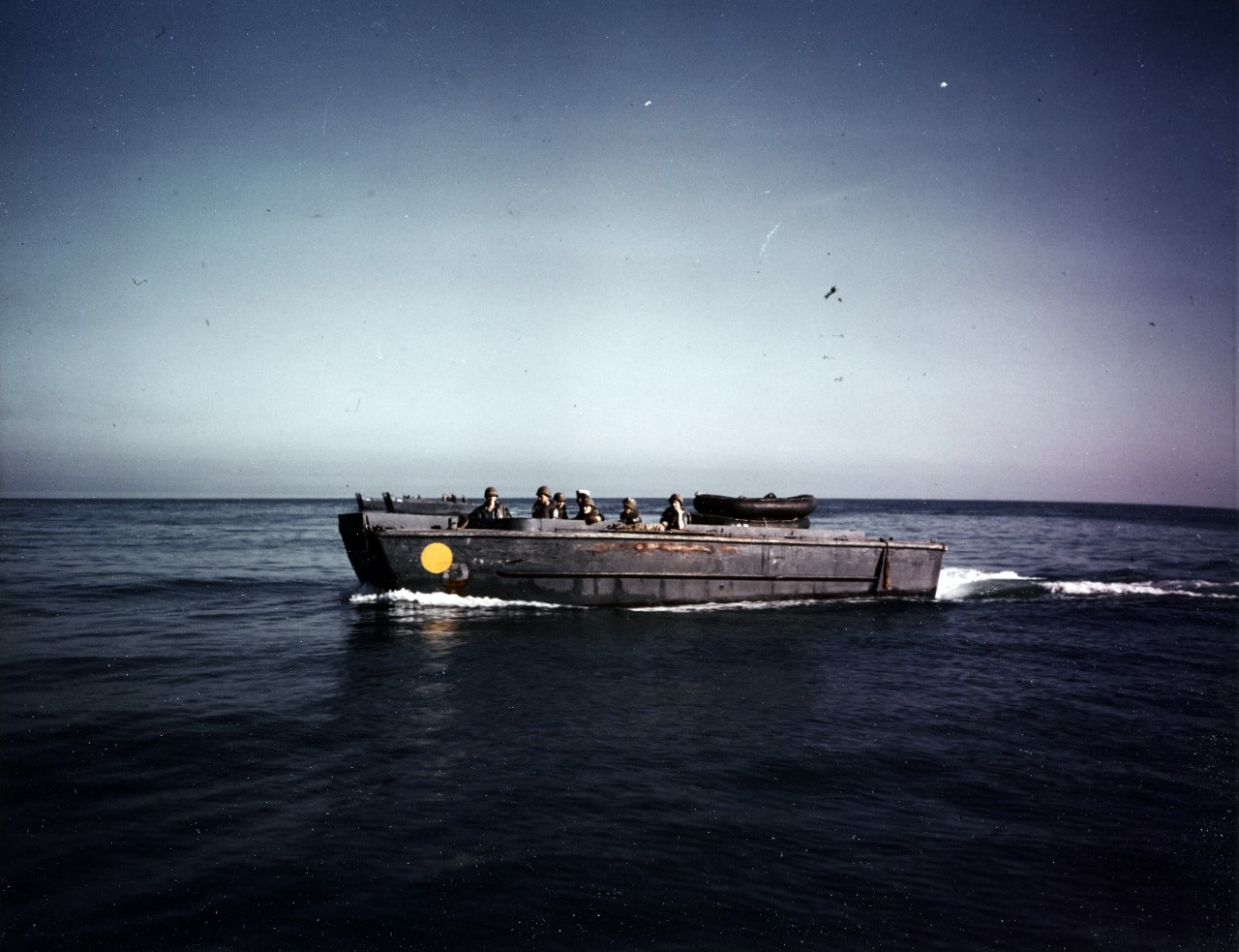 LCP(R) operating off Camp Bradford, Little Creek, Virginia, during amphibious training exercises, circa 1943-1944. Note rubber inflatable boats it is carrying.