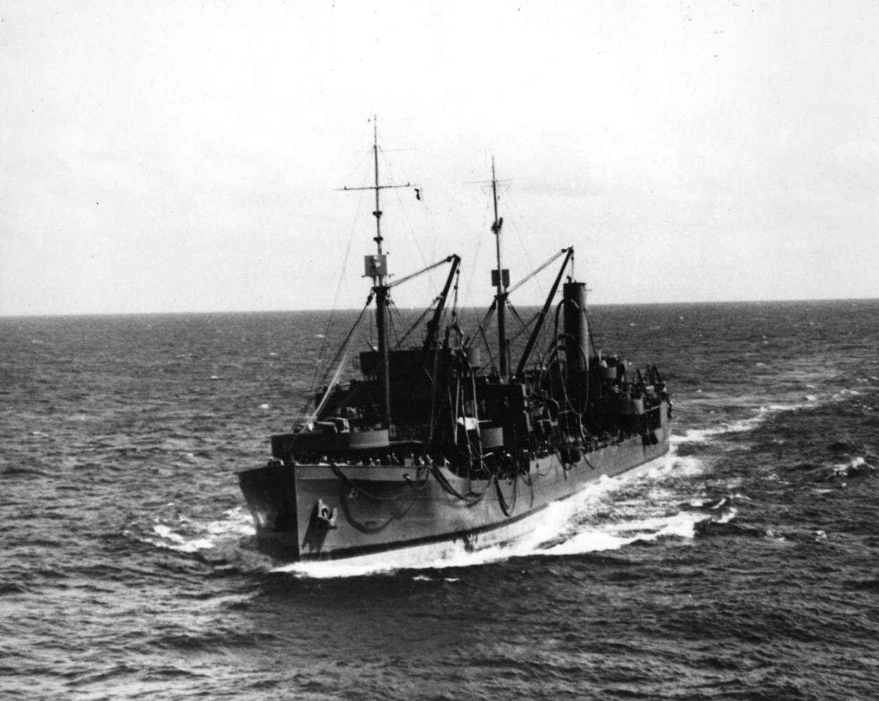 Oiler USS Tippecanoe (AO-21) coming alongside USS Wasp (CV-7), 11 July 1942. The ships were steaming with a convoy of transports taking the 2nd Marine Regiment from San Diego to the Tonga Islands.