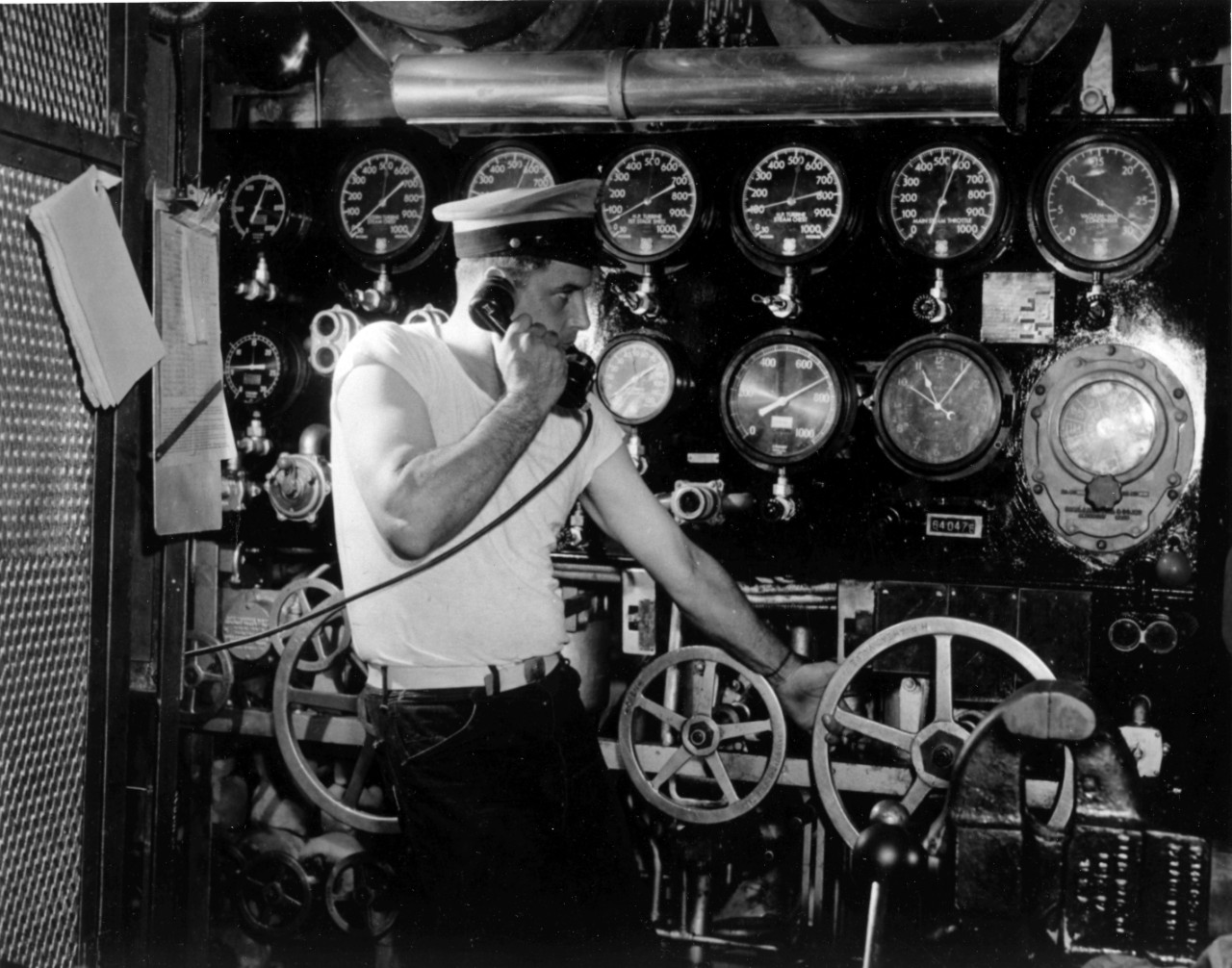 USS Jouett (DD-396) - chief petty officer stands watch in the after engine room during operations in the South Atlantic, May 1942. 