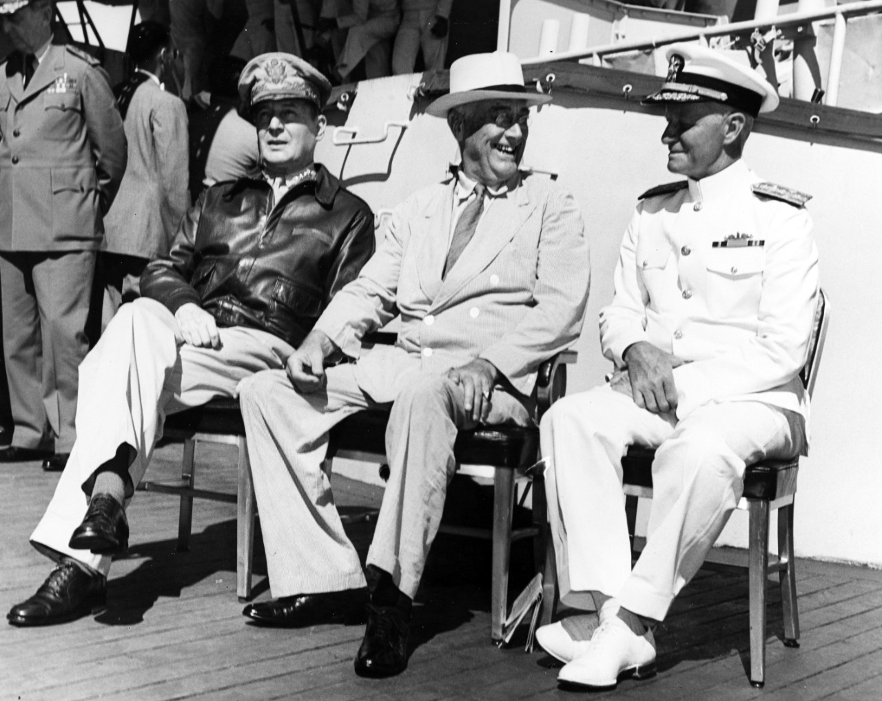 Photo #: 80-G-241479  General Douglas MacArthur, U.S. Army (left); President Franklin D. Roosevelt (center); and Admiral Chester W. Nimitz, USN (right)