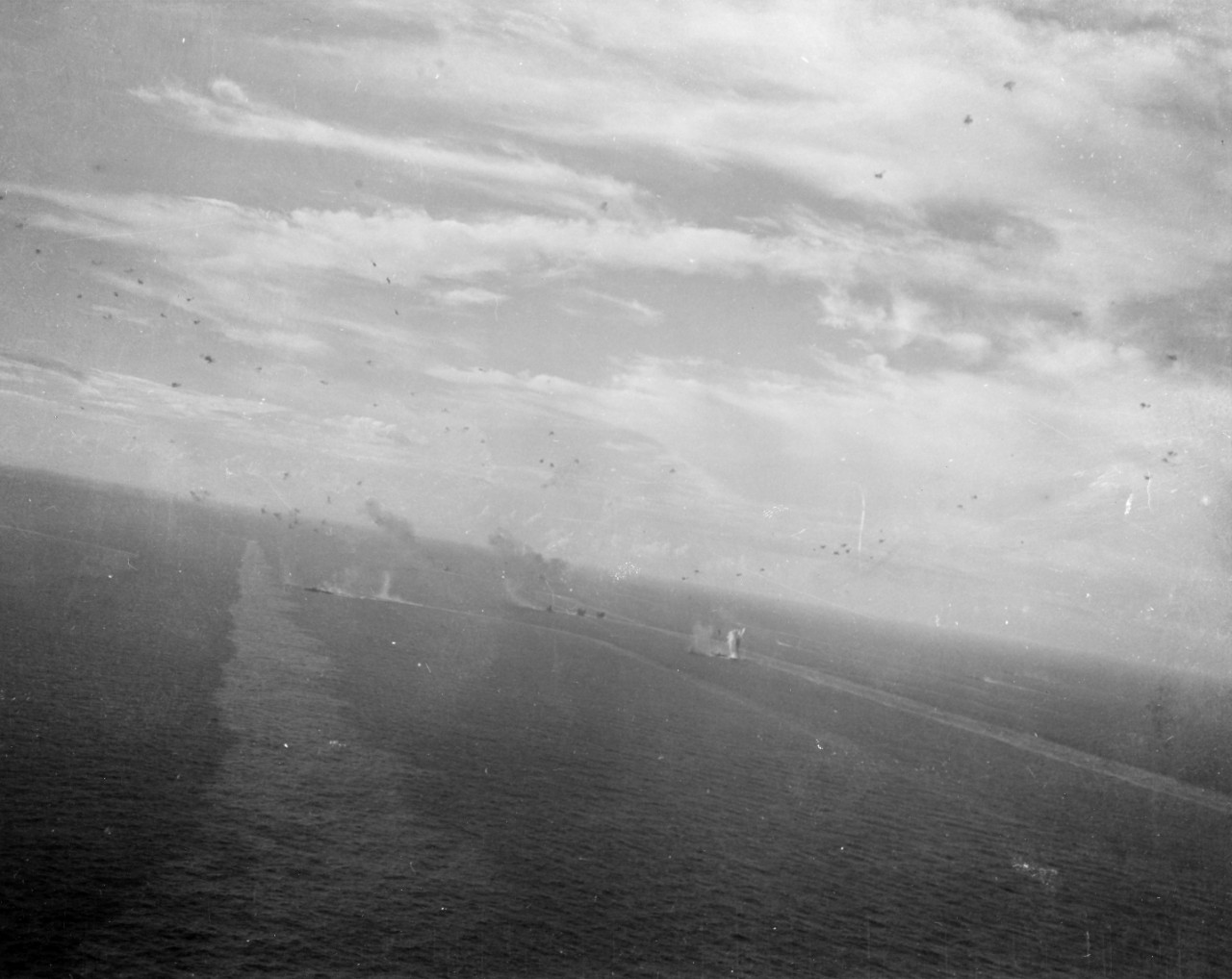 Air attacks on the Japanese fleet, during the Battle off Samar, 25 October 1944. Note oil slicks from damaged ships.