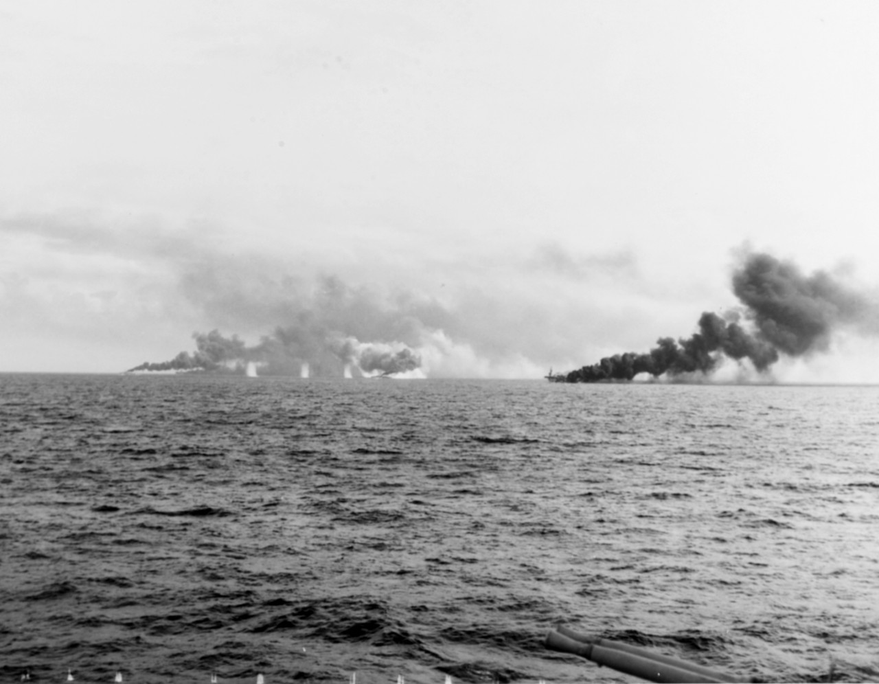 Ships of Carrier Division 25 under fire during the Battle off Samar, 25 October 1944. Photographed from USS White Plains.