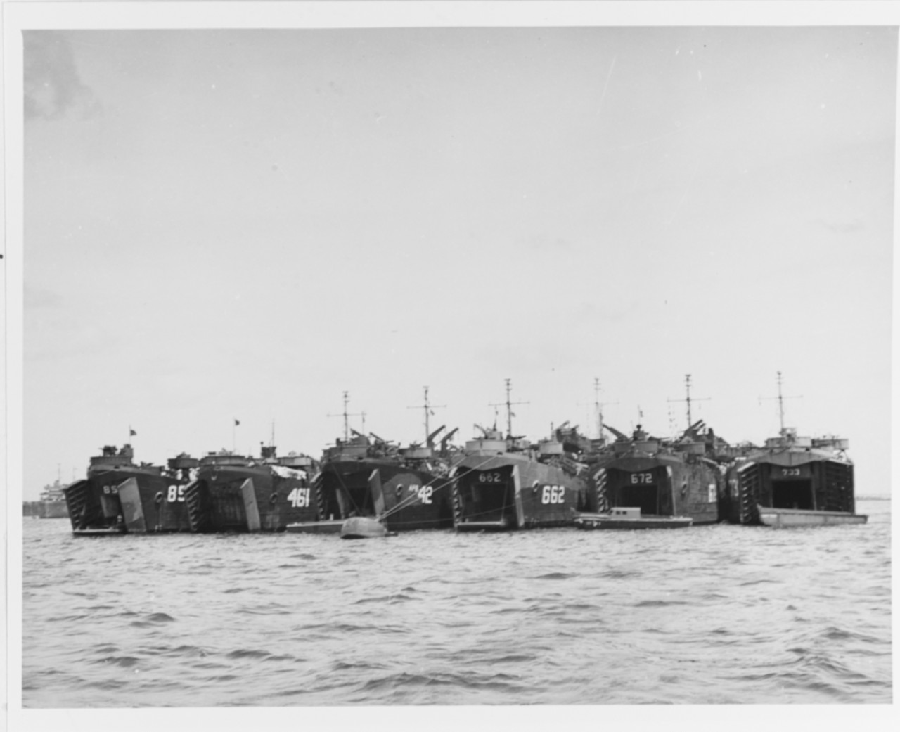 Photo #: 80-G-350133  Tank Landing Ships (LST) and a Barracks Ship (APB) moored together, 1945.