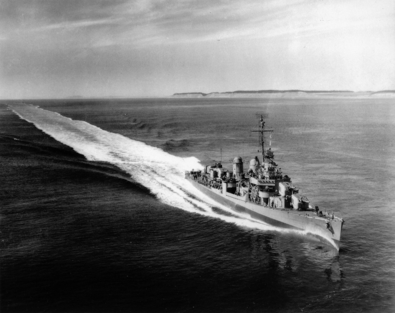 USS Izard (DD-589) underway at high speed. Since no national ensign appears to be flying, photo may have been taken during builder's trials prior to commissioning. 