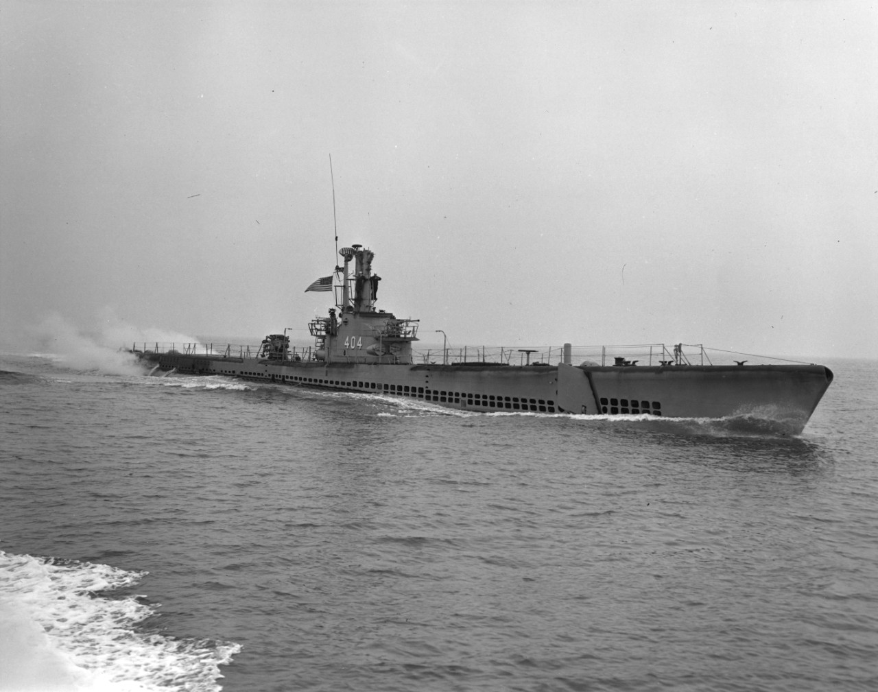 Starboard bow view of submarine USS Spikefish (SS-404) underway on the surface