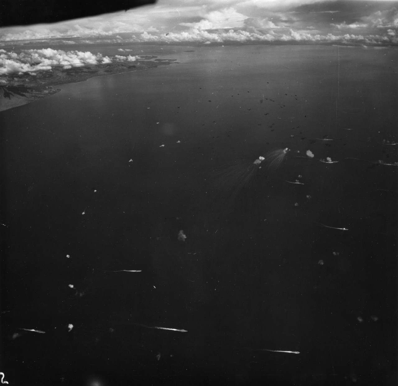 Japanese fleet under attack during the Battle of the Sibuyan Sea, 24 October 1944. Note the very large anti-aircraft bursts in right center.