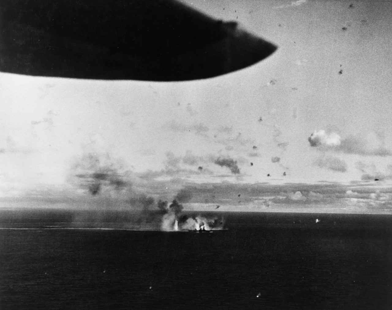 Air attack on Japanese battleship Ise or Hyuga, seen from a U.S. carrier aircraft.