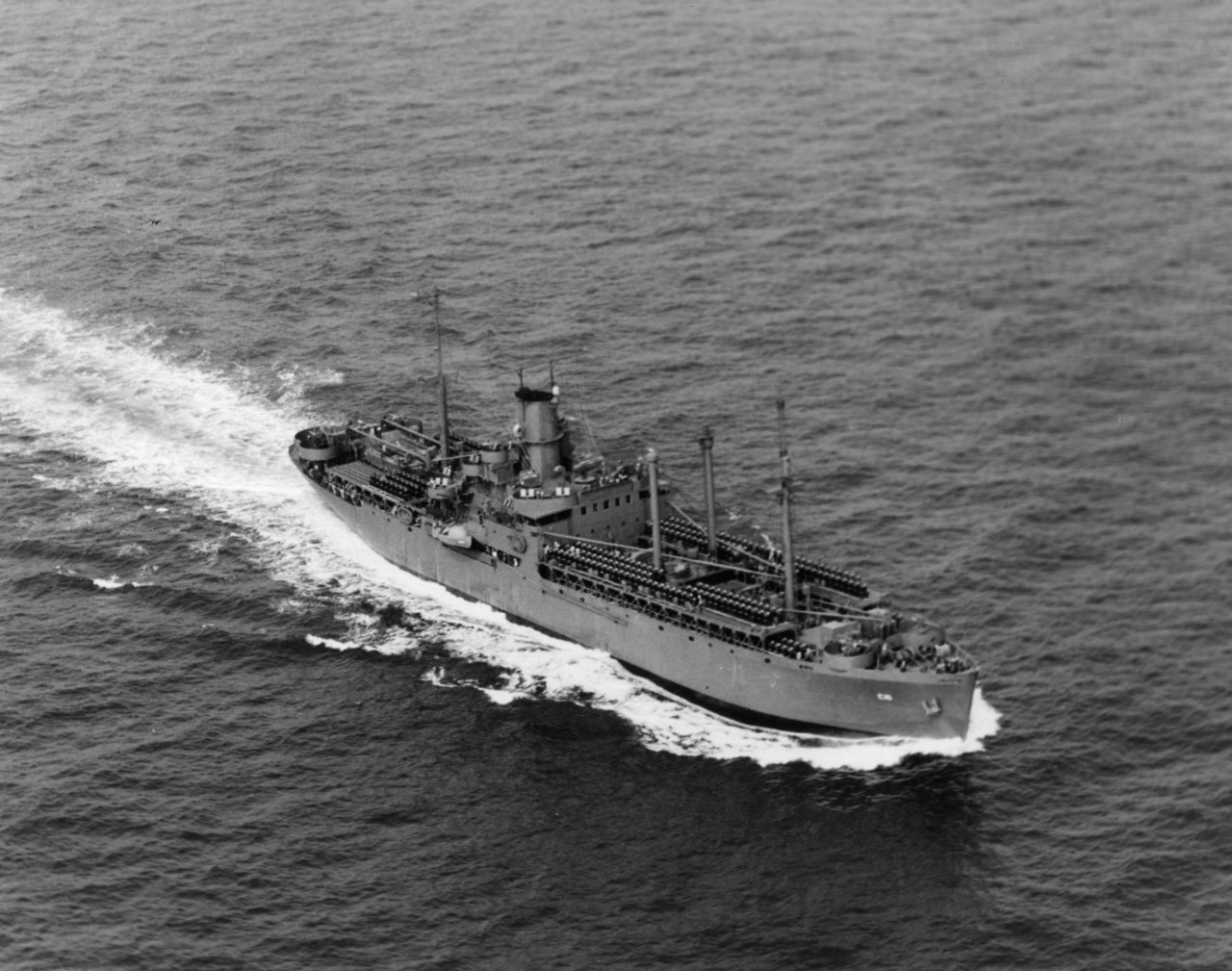 USS Sangay (AE-10) underway, May 1943. Note mines on deck.