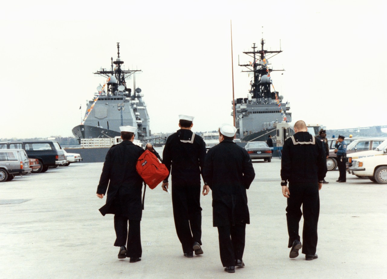 Sailors walk along the newly constructed Pier 1 as they return to the guided missile cruiser USS Ticonderoga (CG-47) and the destroyer USS Hayler (DD-997, docked in the background. The ships are in New York City during Navy Fleet Week activities.