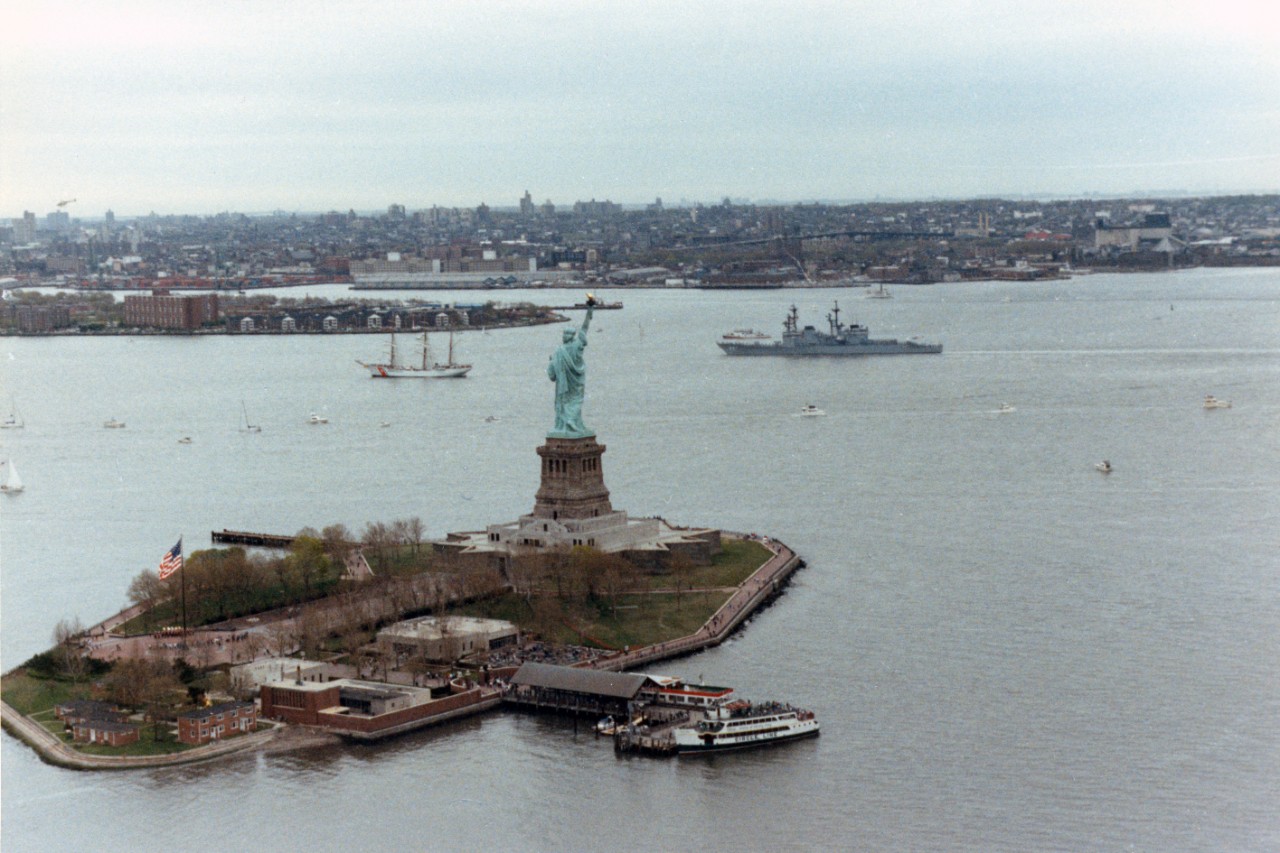 The destroyer USS Hayler (DD-997) and the training cutter USCGC Eagle (WIX-327) pass the Statue of Liberty as they arrive for Navy Fleet Week activities in New York City.