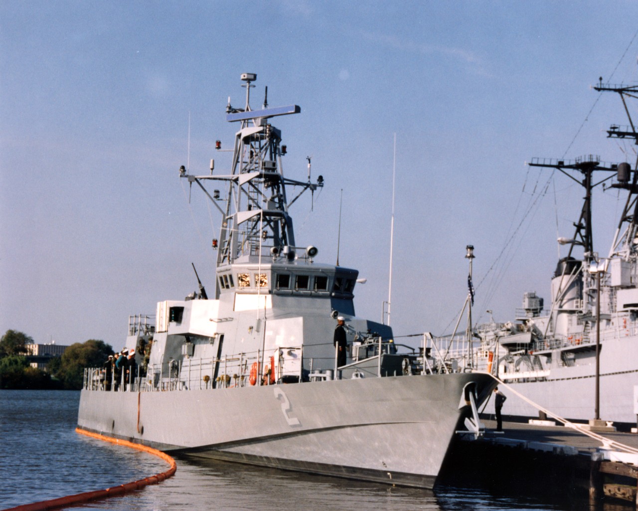 Starboard bow view of coastal patrol ship USS Tempest (PC-2), moored next to the display ship Barry (DD-933) at the Washington Navy Yard.
