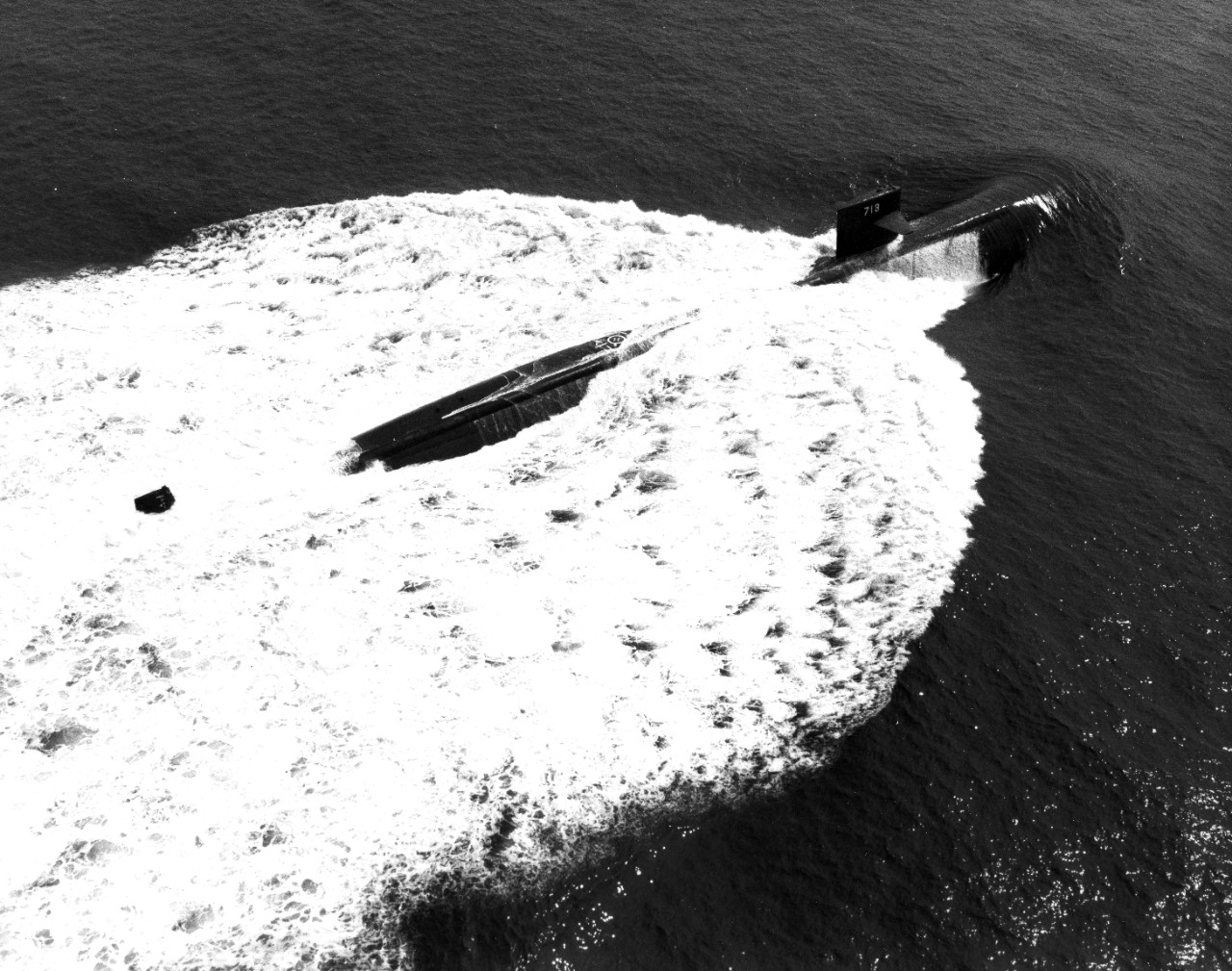 Atlantic Ocean - aerial starboard quarter view of the nuclear-powered attacked submarine USS Houston (SSN-713) underway. August 17, 1982. 
