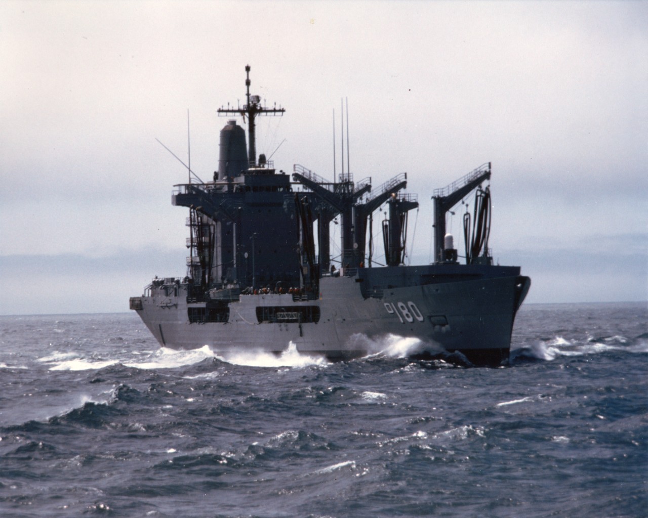 Port quarter view of fleet oiler USS Willamette (AO-180) underway during a midshipmen's summer training cruise, July 1986.