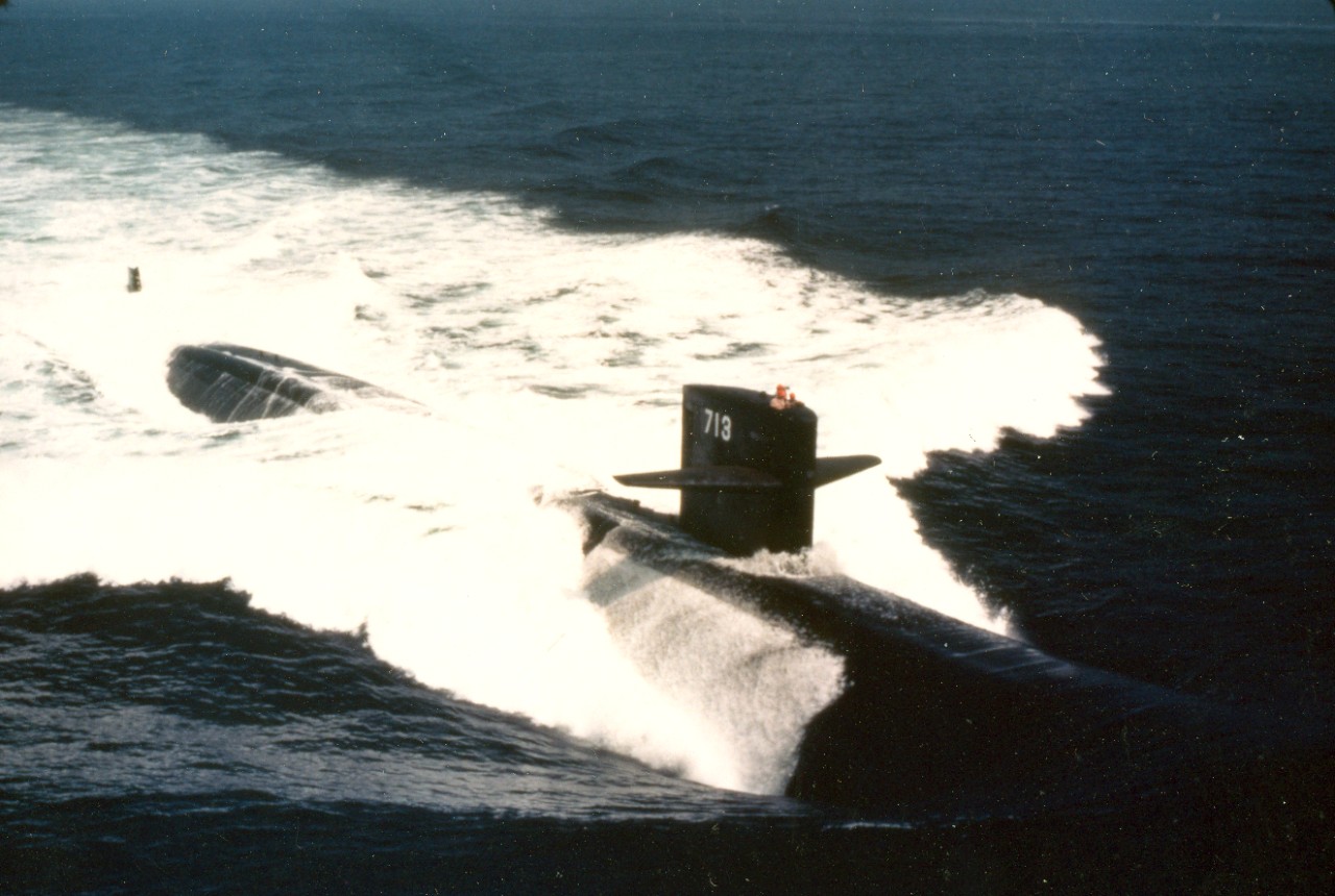 A starboard bow view of the nuclear-powered attack submarine USS Houston (SSN-713) underway during sea trails. August 1982. 