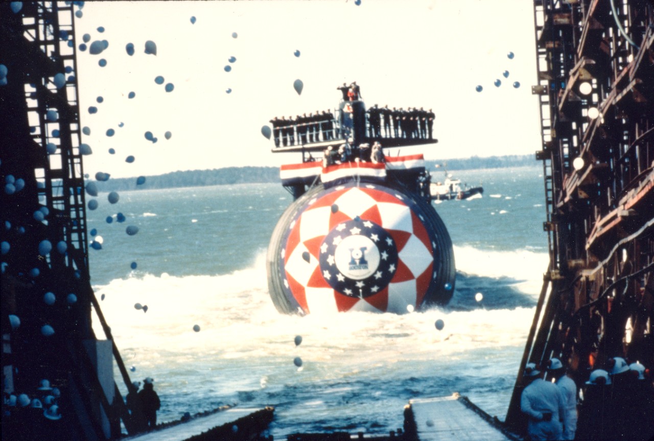 A bow view of the nuclear-powered attack submarine USS Houston (SSN-713) sliding down the ways during the launching ceremony. March 21, 1981. 