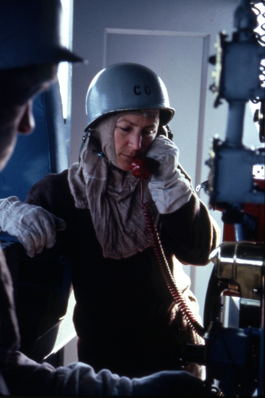 <p>Naples, Italy - LCDR&nbsp;Darlene M. Iskra, commanding officer of the salvage ship USS Opportune (ARS-41), communicates by phone from the bridge during a general quarters drill, circa 1991.&nbsp;LCDR Iskra was the first woman to command an active US Navy ship.</p>
