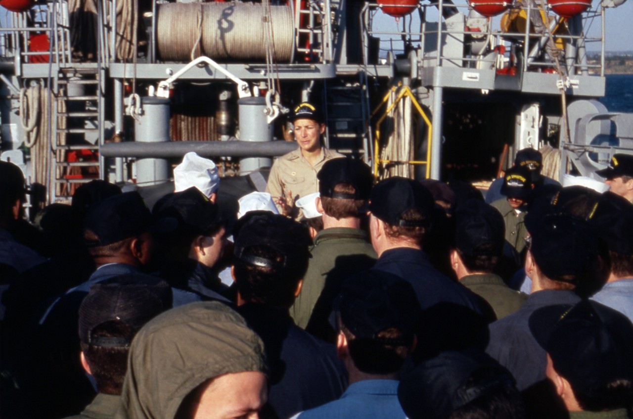 <p>Naples, Italy - LCDR&nbsp;Darlene M. Iskra, commanding officer of the salvage ship USS Opportune (ARS-41), speaks to the crew, circa 1991.&nbsp;LCDR Iskra was the first woman to command an active US Navy ship.</p>
