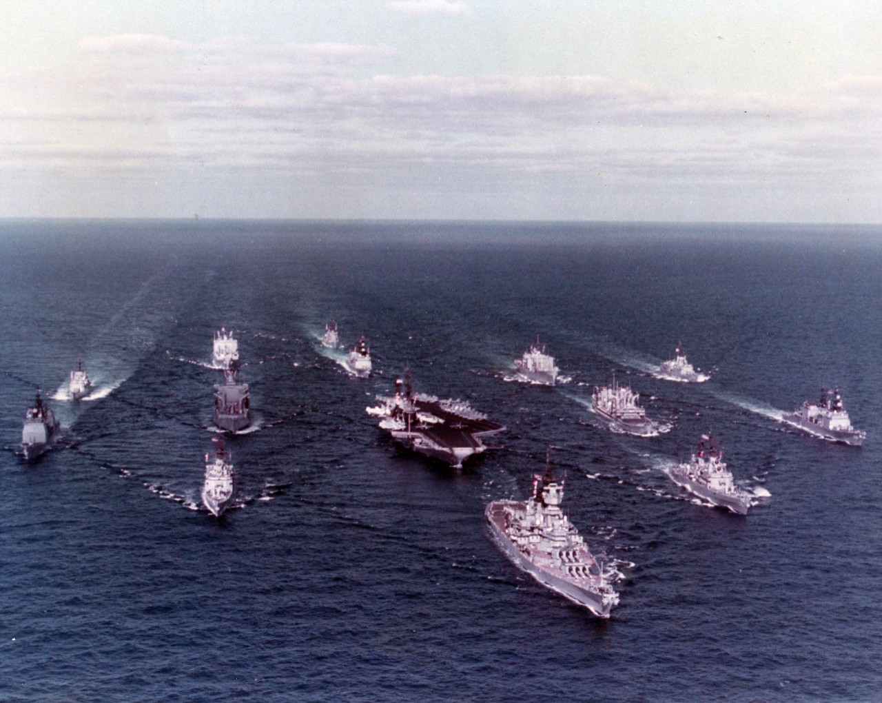 USS Iowa (BB-61) leads Battle Group Alfa formation at sea, circa 1985-1987.
