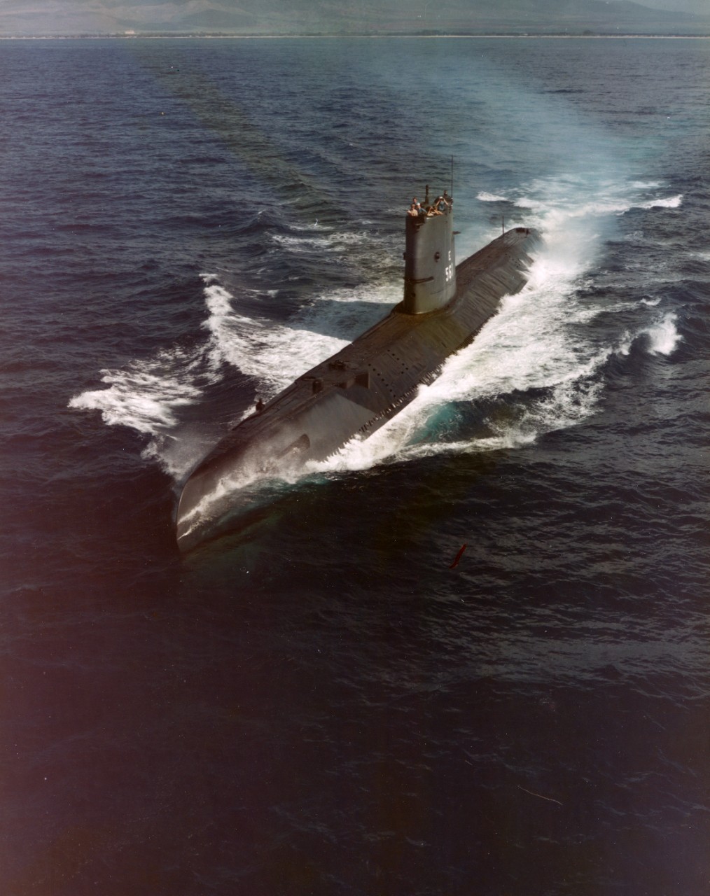Aerial view of submarine USS Tang (SS-563) underway on the surface, off the coast of Oahu, Hawaii