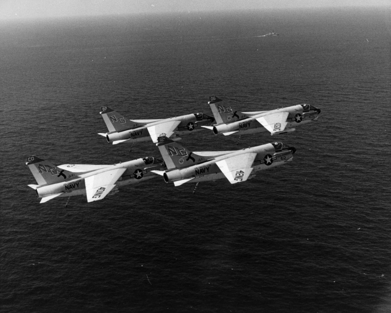 A-7E Corsair II attack aircraft from Attack Squadron 147 (VA-147) fly in formation over the Indian Ocean. They are assigned on board attack aircraft carrier USS Constellation (CVA-64) and are taking part in operation Midlink '74.