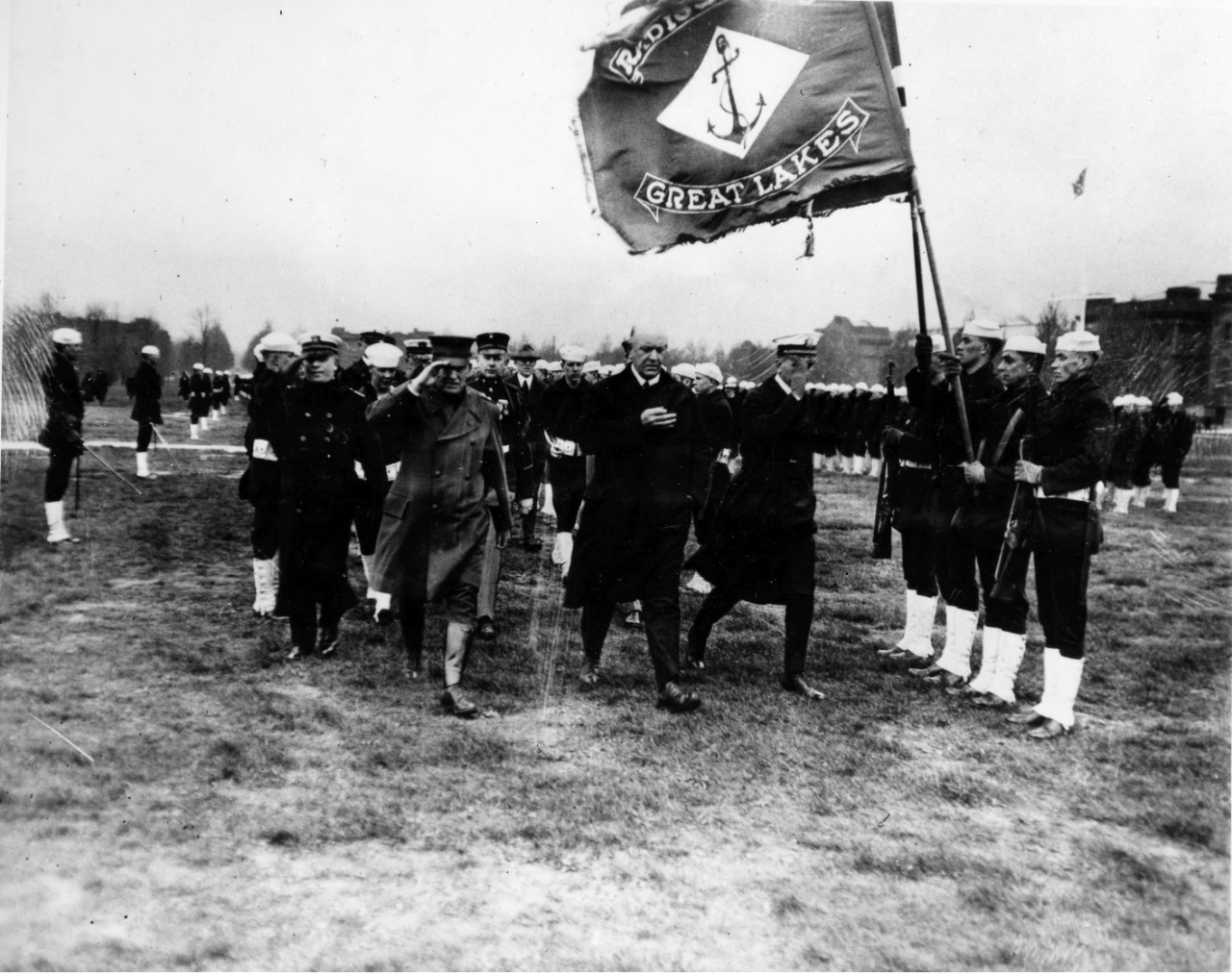 MGen John A. Lejeune, SecNav Edwin Denby, and CAPT William A. Moffett inspect sailors at NTC Great Lakes, IL circa early 1920s. Note flag of the radio school at the right. 