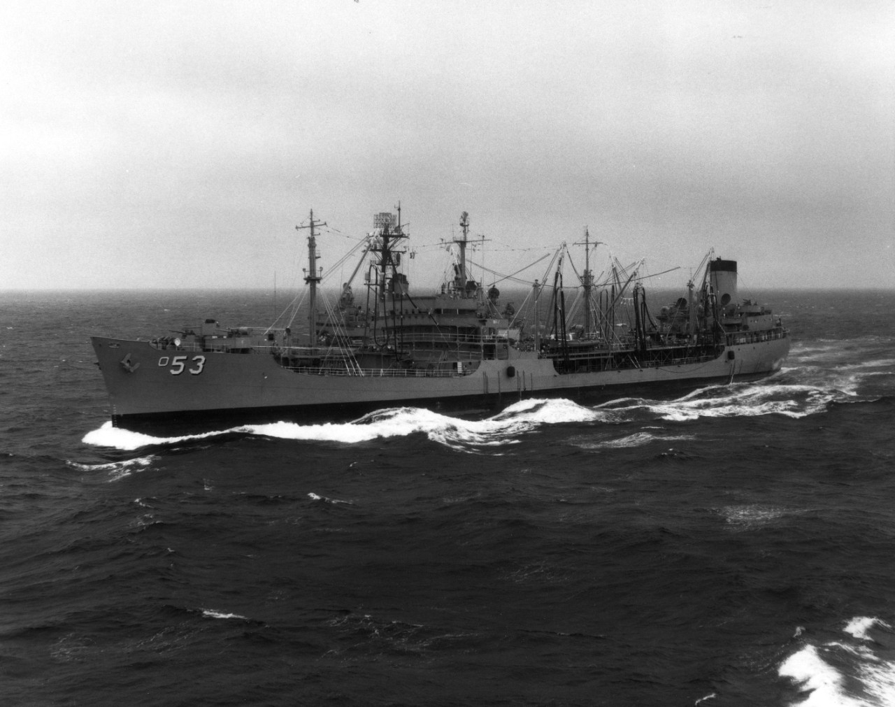 USS Caliente (AO-53) operating off the coast of Japan, alongside USS Ranger (CV-61)