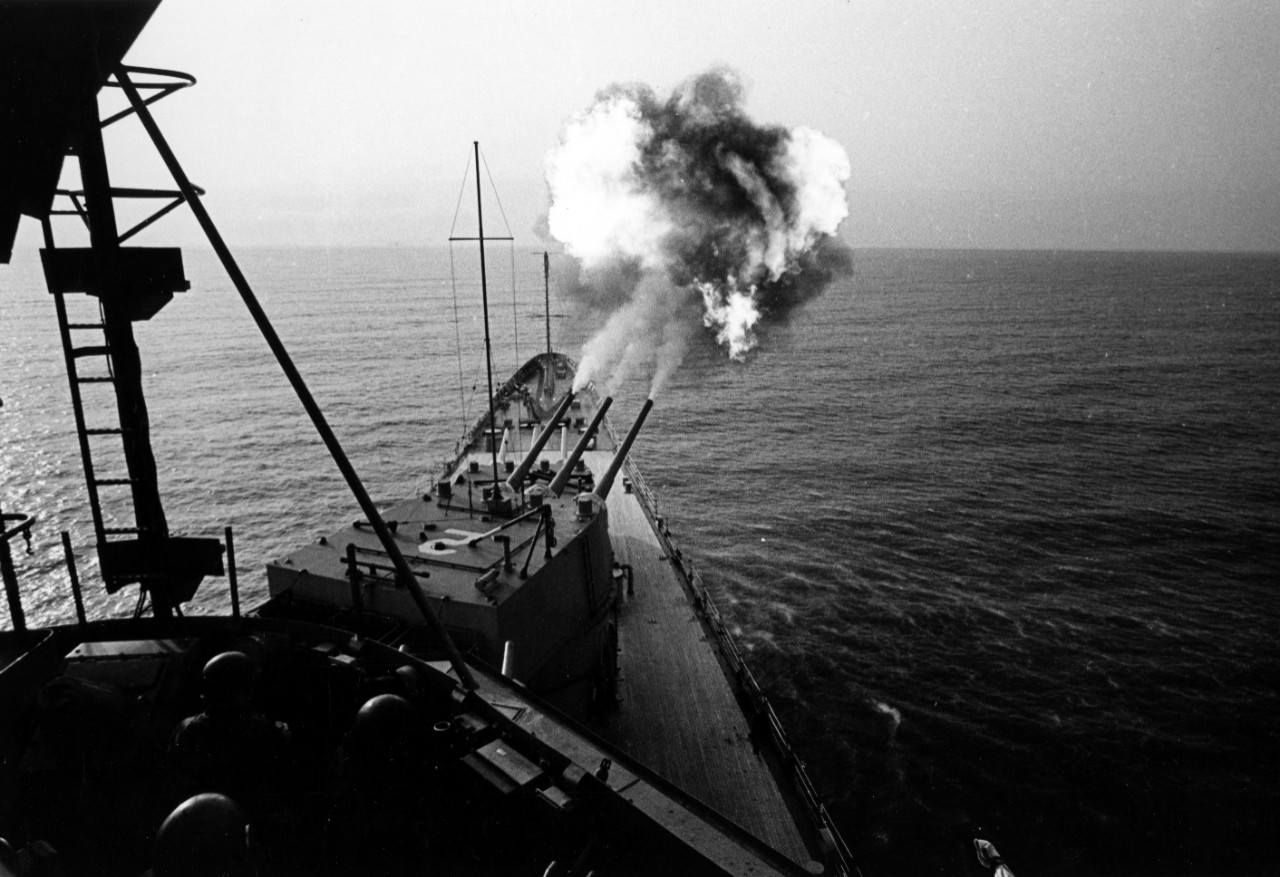 Gulf of Tonkin - the guided missle heavy cruiser USS Canberra (CAG-2) fires eight inch guns at North Vietnamese military targets during operation Sea Dragon. May, 20, 1967. 