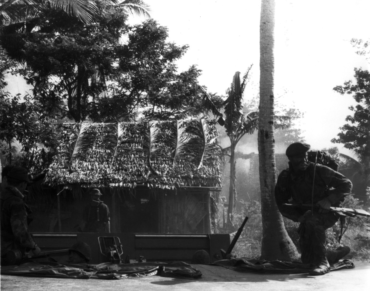 U.S. Navy SEALs go ashore into a heavily infested enemy area along the Bassac River, 67 miles south west of Saigon, to conduct a one-day Operation Crimson Tide against enemy fortifications, bunkers, and sampans.