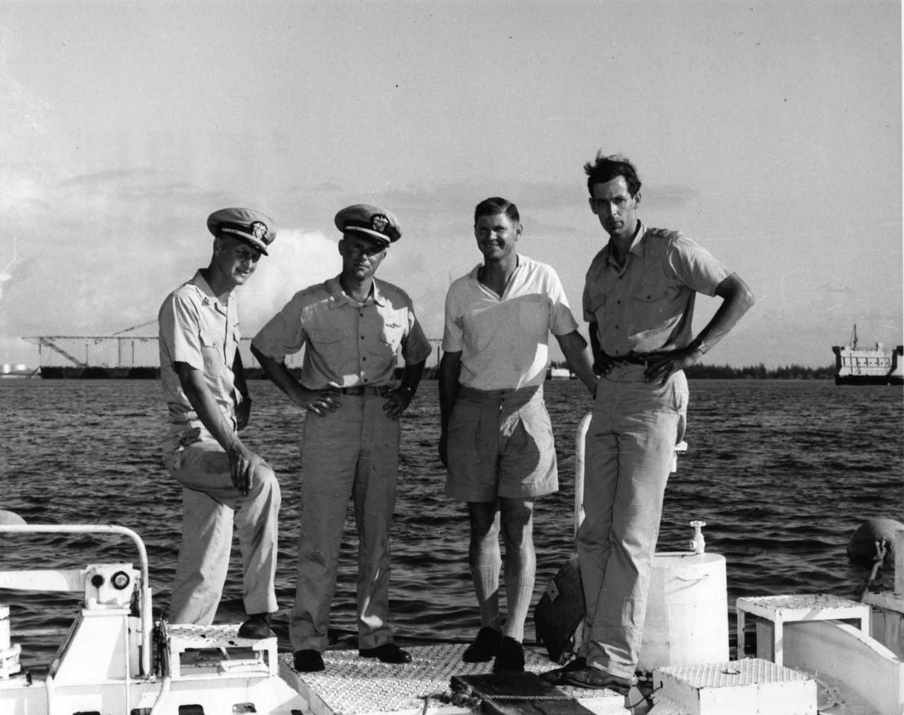 Left to Right: Lieutenant Larry Shumaker, Assistant Officer in Charge; Lieutenant Donald Walsh, Officer in Charge; Dr. Andreas B. Rechnitzer, Scientist in Charge; Jacques Piccard, Co-Designer and Technical Advisor of Bathyscaphe Trieste.