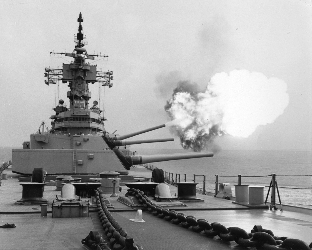 USS New Jersey (BB-62) fires one 16 inch gun of turret two.