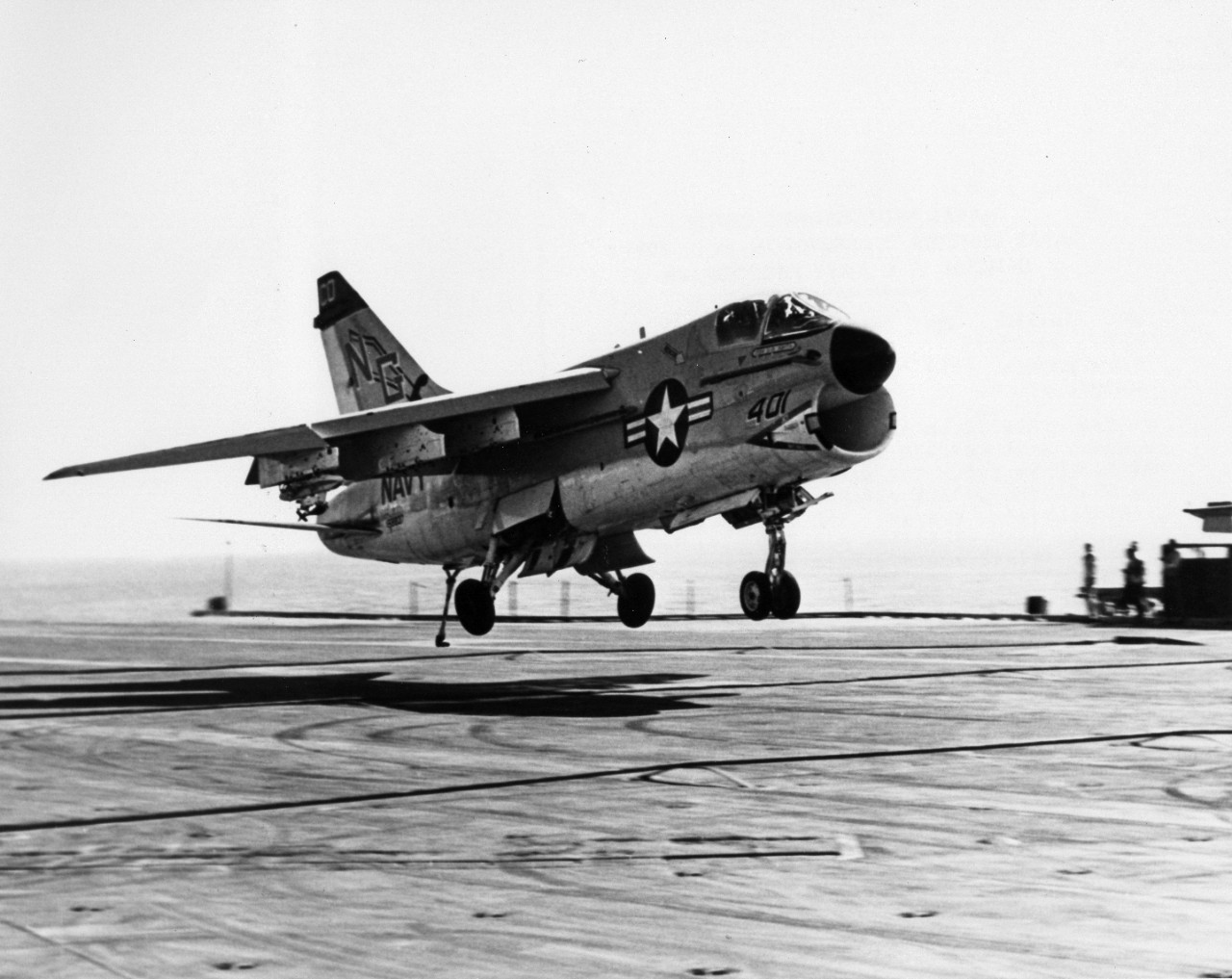 An A-7E Corsair II attack aircraft from Attack Squadron 147 (VA-147) prepares to catch the wire during a recovery on board the attack aircraft carrier USS Constellation (CVA-64). The vessel is involved with Operation Midlink '74, the Central Treaty Organization naval exercise.
