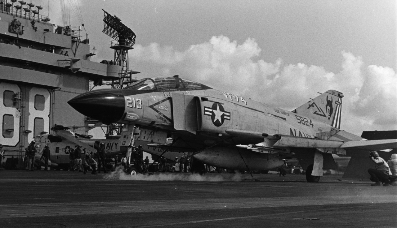 A Fighter Squadron 74 (VF-74) F-4J Phantom II fighter aircraft is ready for launching from the waist catapult of the nuclear powered aircraft carrier USS Nimitz (CVN-68).