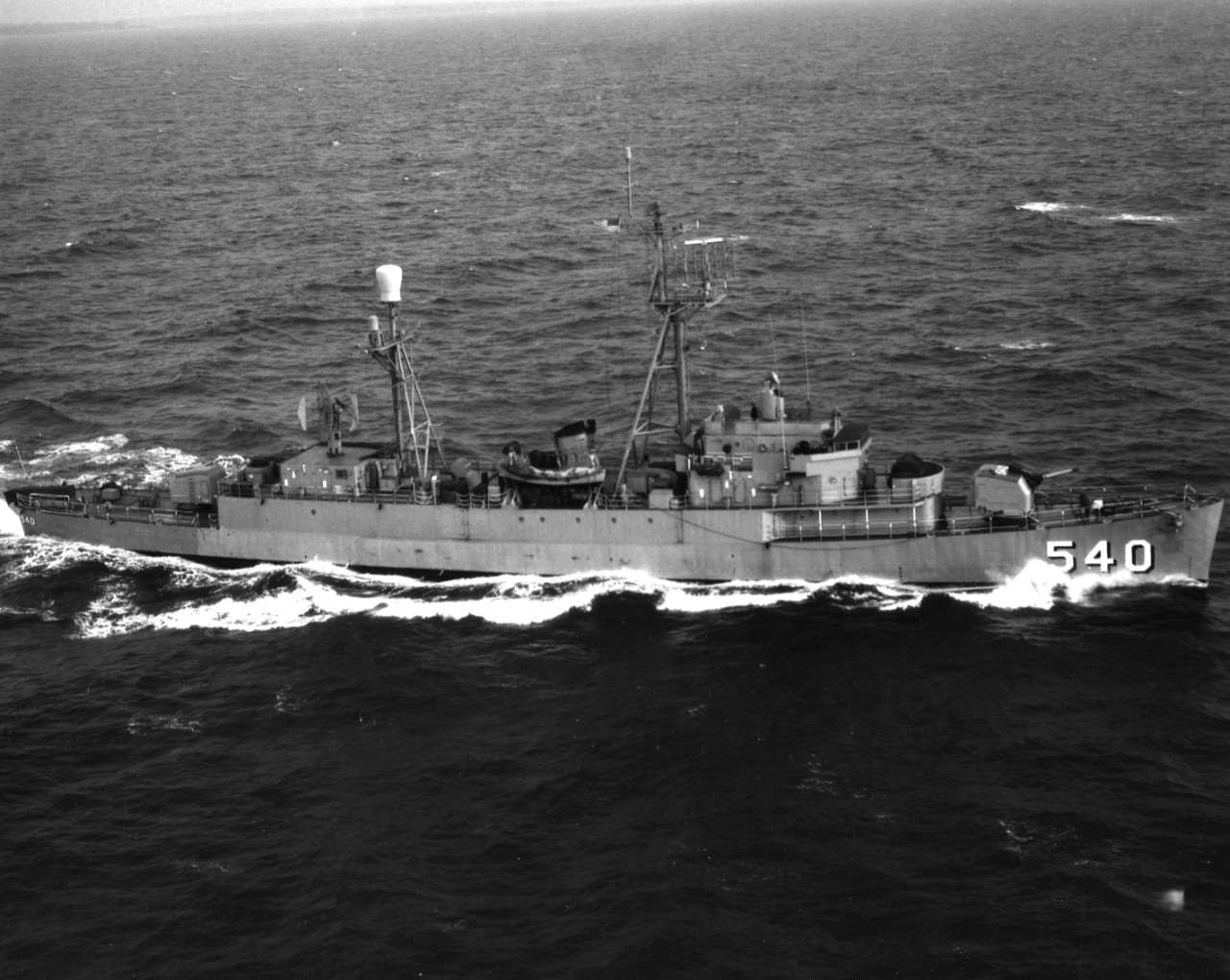 Aerial view of radar picket escort ship USS Vandivier (DER-540) underway