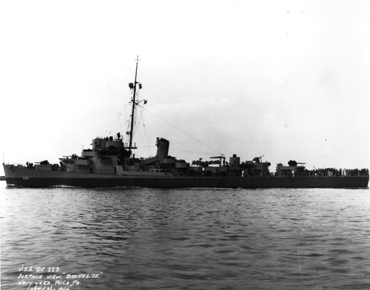 Port view of destroyer escort USS Spangenberg (DE-223) underway, possibly off the Philadelphia Navy Yard
