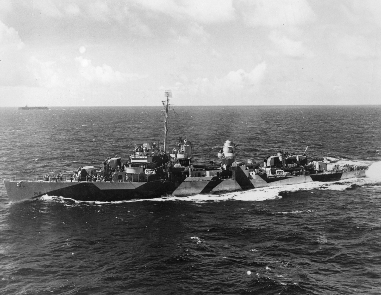 USS Morrison (DD-560) underway, in a photo taken from USS Gambier Bay (CVE-73). Another aircraft carrier can be seen in the distance.