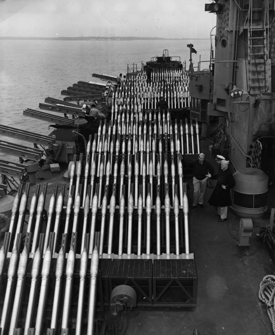 Rows of rocket launchers, loaded with their deadly missiles, add immeasurably to the firepower of this Navy landing craft. Light and mobile, the self-propelled weapons have played a major role in World War II.