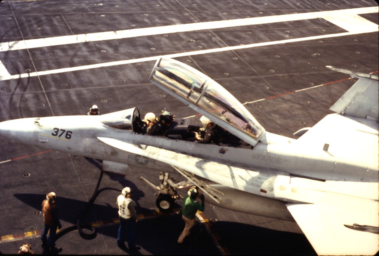 <p>A TF/A-18 Hornet aircraft from VF-106 is serviced on USS Dwight D. Eisenhower (CVN-69)</p>
