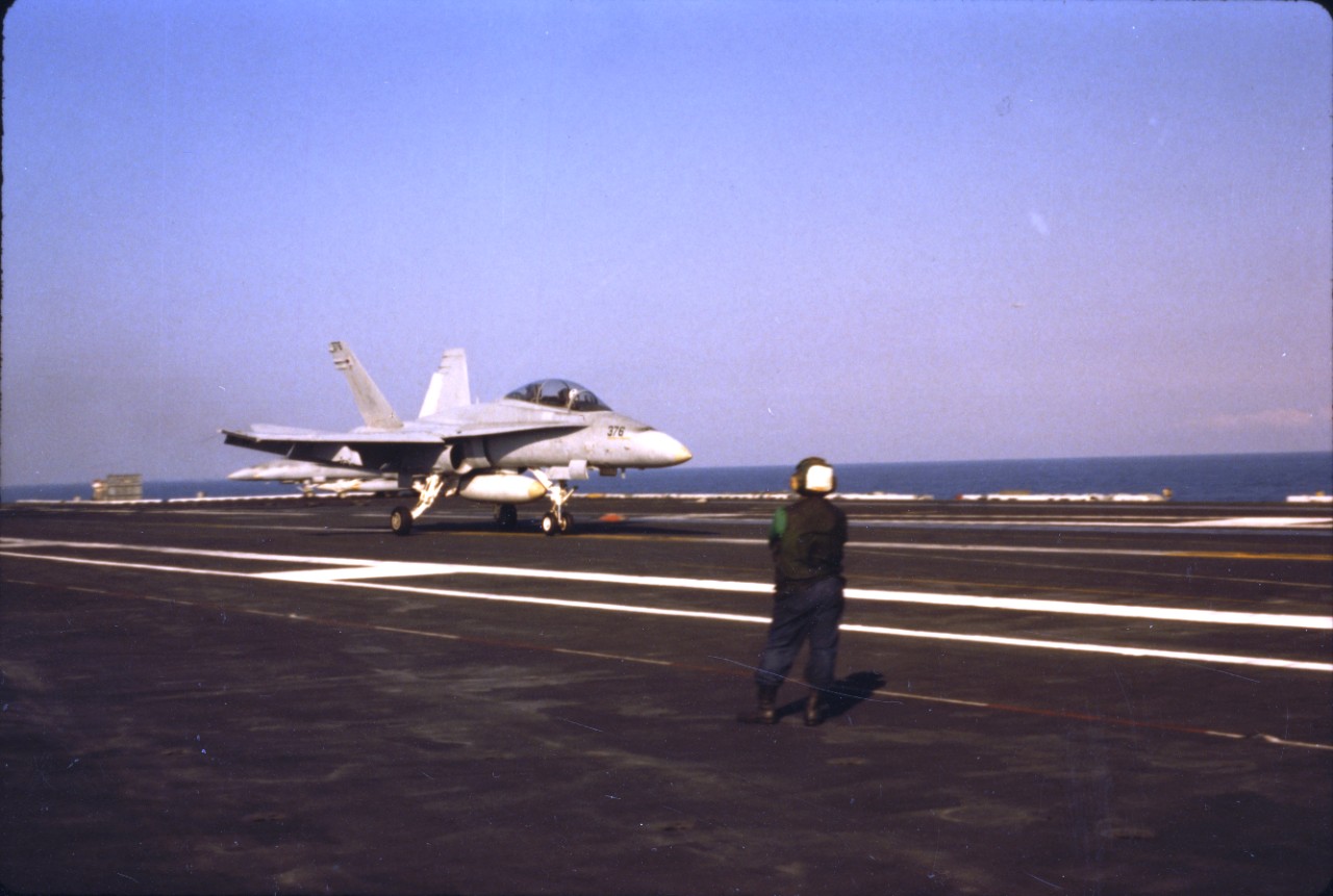 <p>A TF/A-18 Hornet aircraft from VF-106 lands aboard USS Dwight D. Eisenhower (CVN-69)</p>

