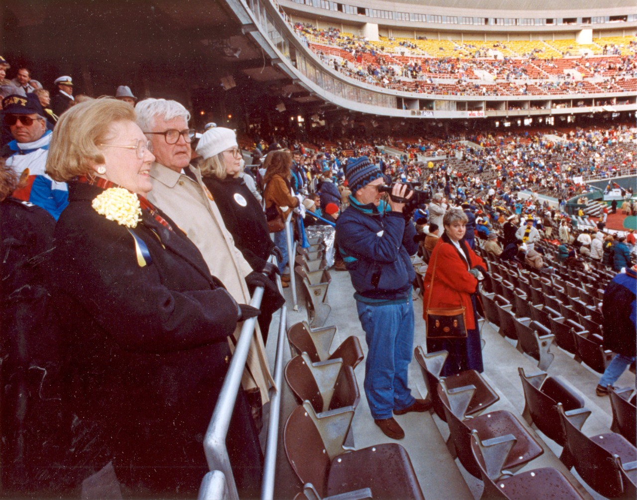 <p>VADM James B. Stockdale and Mrs. Stockdale attend a Navy football game. Undated photograph.</p>
