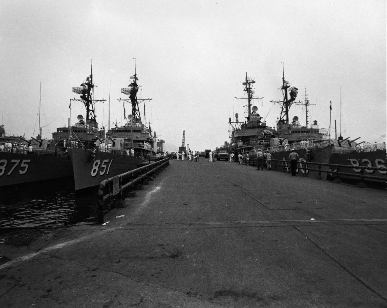 Ships of Destroyer Division 32 tied up at Yokusuka, Japan. Just minutes after this picture was taken the ships were underway for home, concluding more than 18 months off the coast of Vietnam. Seen are USS Henry W. Tucker (DD-875), USS Rupertes (DD-851), and USS George K. MacKenzie (DD-836).