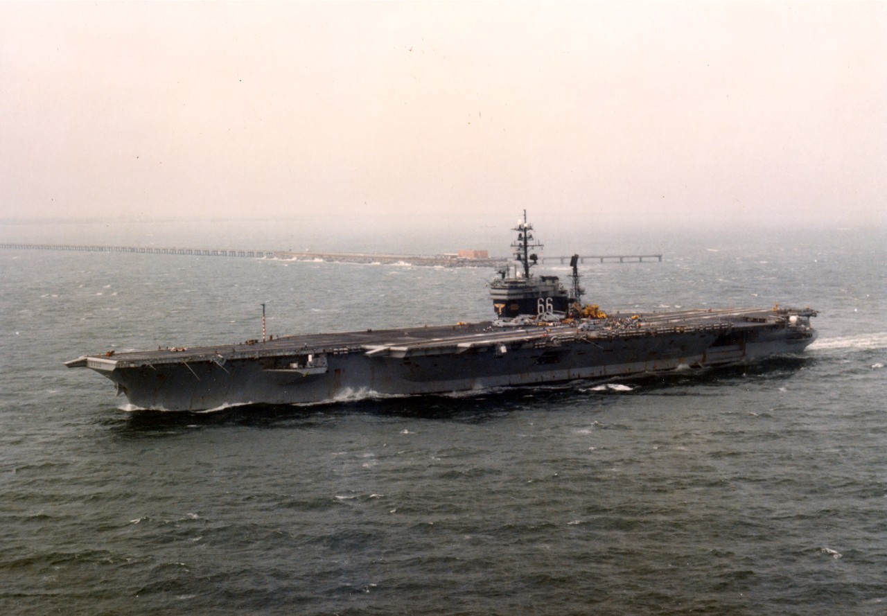 Passing by the Chesapeake Bay Bridge Tunnel on 28 August, 1995, USS America (CV-66) heads for open water on it's final deployment to the Mediterranean before decommissioning next year. 