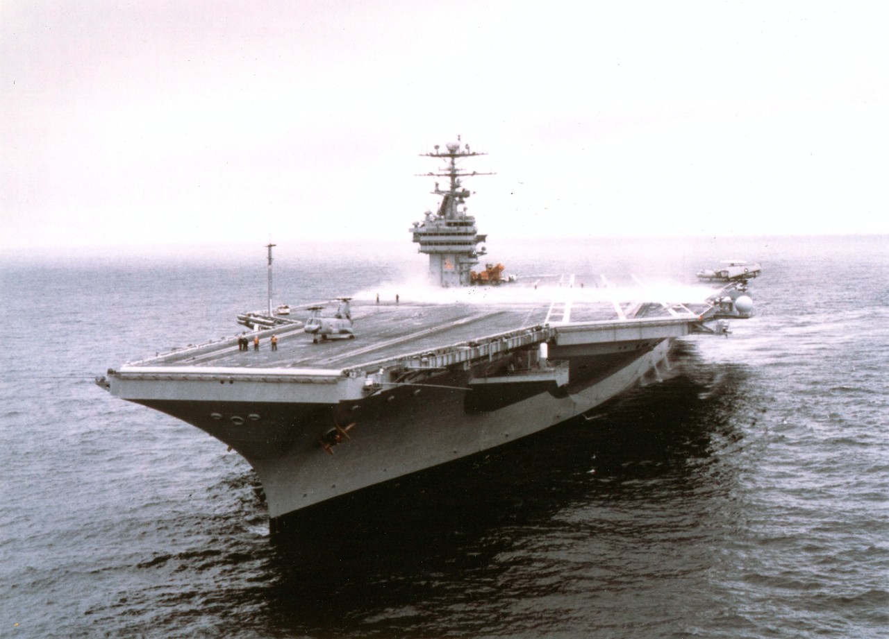 Nuclear powered aircraft carrier USS George Washington (CVN-73) conducts a test of her counter-measure washdown system while operating in the Virginia Capes, February 28, 1997. George Washington had just completed an unprecedented and highly successful six-month Planned Incremental Availability (PIA) at Norfolk Naval Shipyard and was conducting post-shipyard sea trials. 