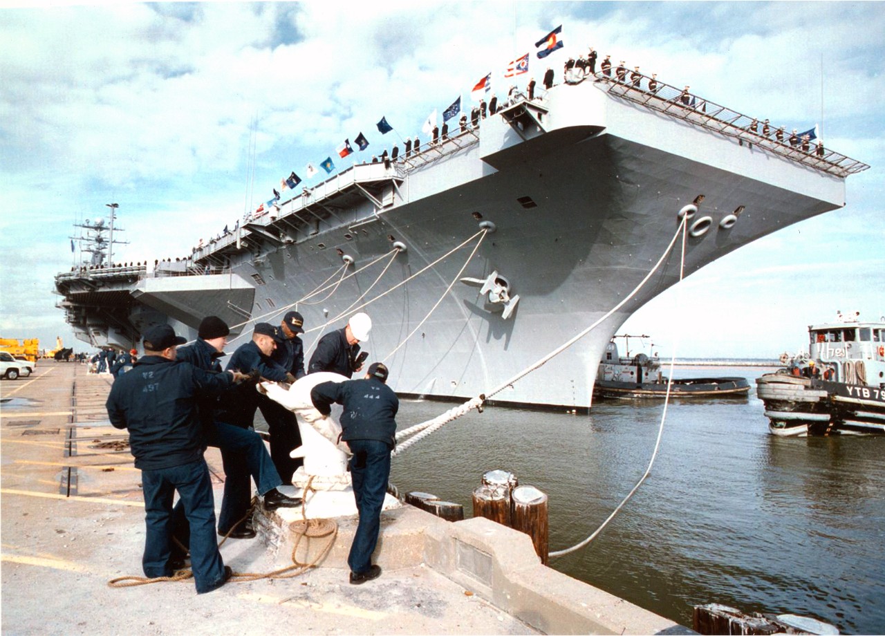 Sailors cast off mooring lines during sea and anchor detail for the Navy's nuclear powered aircraft carrier USS George Washington (CVN-73). George Washington got underway for a scheduled six-month deployment to the Mediterranean, January 26, 1996. She will be operating in the Adriatic Sea in support of the NATO peace keeping operation Joint Endeavor. 